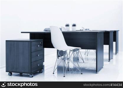 wood tables and white plastic chairs in the office