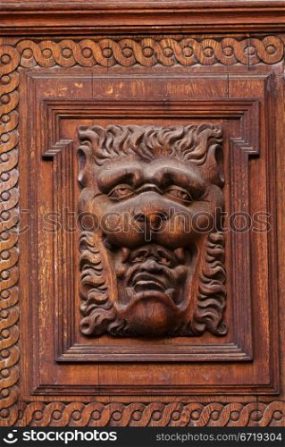 Woodcarvings. Detail of the gate on Old Town Hall in Prague.