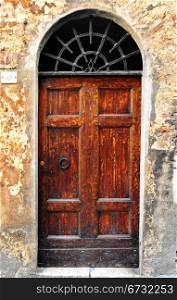Wooden Ancient Italian Door in Historic Center