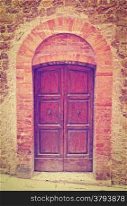 Wooden Ancient Italian Door in Historic Center, Retro Effect