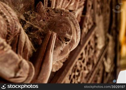 Wooden Apsara Details. Wooden Apsara Close-Up details at temple in Mandalay Myanmar Burma