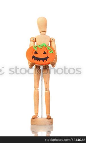 Wooden articulated doll holding a pumpkin cookie on the white isolated background