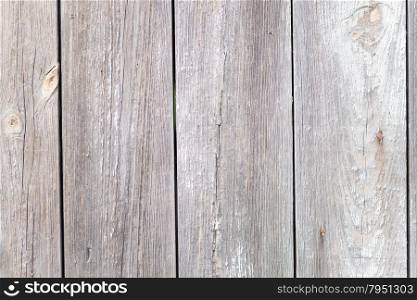 Wooden background from the old unpainted boards closeup