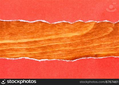 Wooden background with border of red torn paper