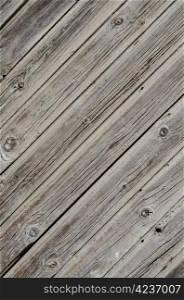 Wooden background with weathered wood and rusty nails.
