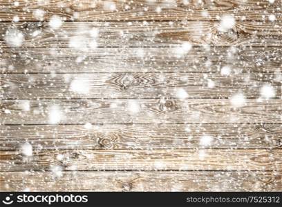 Wooden background. Wood texture with snow. Winter holidays