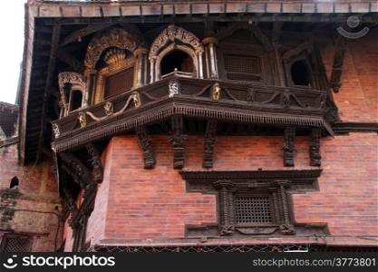 Wooden balcony and windows on the wall of king&rsquo;s palace in Khatmandu