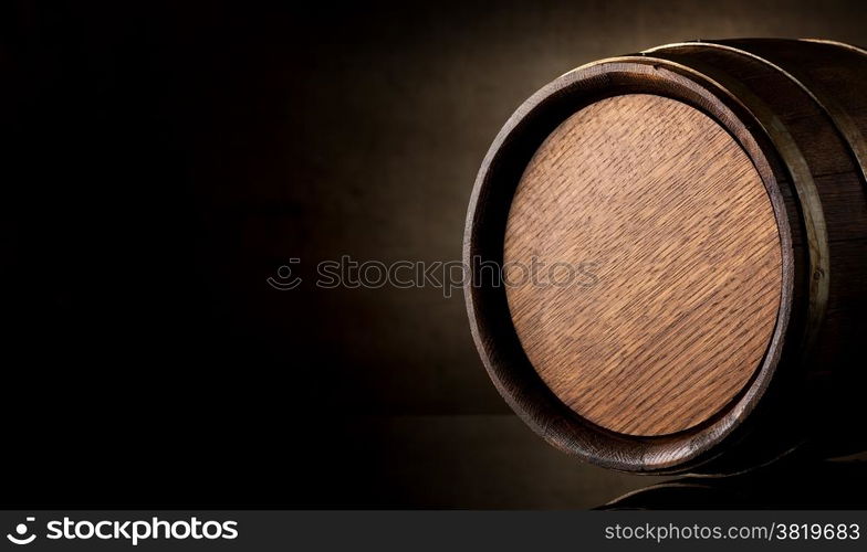 Wooden barrel on a background of brown texture