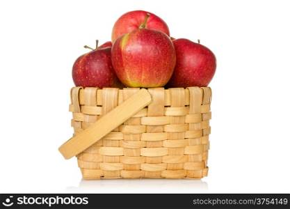 Wooden basket full of red apples. Isolated on white background