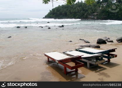 Wooden beds on the Mirissa beach, Sri Lanka