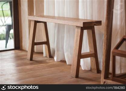 Wooden bench cedorated in house, stock photo