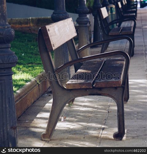 wooden bench in the park in the street