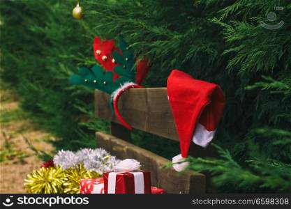 Wooden bench with christmas gifts