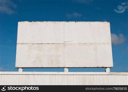 wooden billboard against a blue sky background