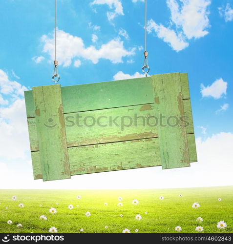 Wooden blank banner. Wooden blank banner hanging on ropes. Place for text