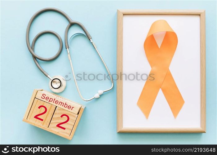 wooden block calendar 22nd september stethoscope orange ribbon multiple awareness