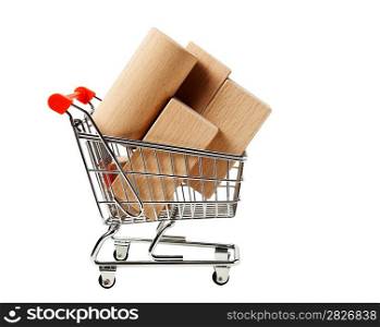 wooden blocks for the construction in shopping trolley isolated on a white background