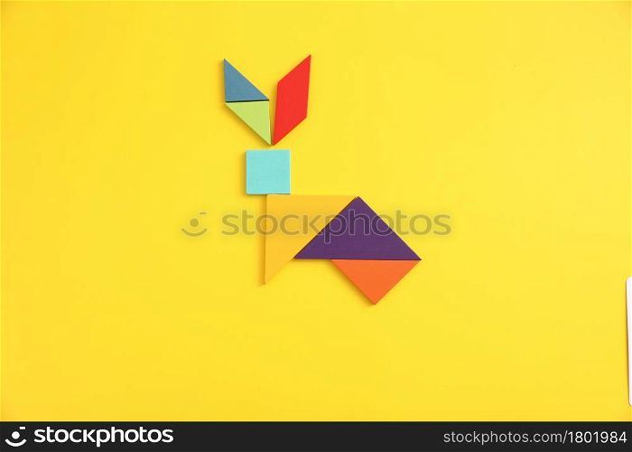 Wooden blocks fox isolated in yellow background