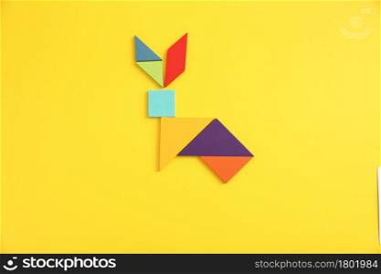 Wooden blocks fox isolated in yellow background