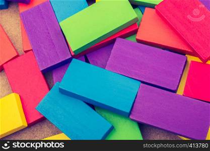Wooden blocks of various color randomly scattered