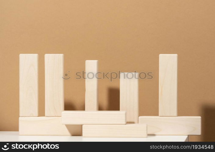 wooden blocks on brown background. Concept scene stage showcase for product, promotion, sale, presentation of cosmetic products