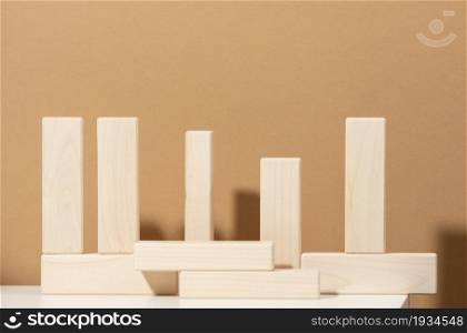 wooden blocks on brown background. Concept scene stage showcase for product, promotion, sale, presentation of cosmetic products