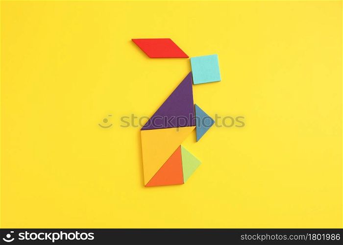 Wooden blocks rabbit isolated in yellow background