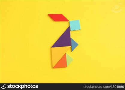 Wooden blocks rabbit isolated in yellow background