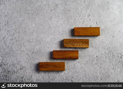 Wooden blocks, used for domino games, Arranged in steps.