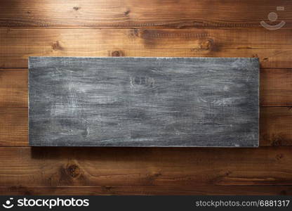 wooden board at brown plank background