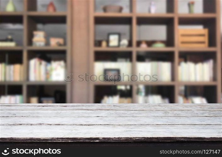 Wooden board empty table space platform in front of blurred library Of The background - can be used for display or montage your products. Mock up for display of product