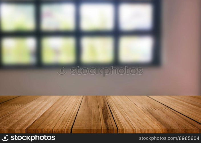 Wooden board empty table space platform in front of blurred Living Room Of The background - can be used for display or montage your products. Mock up for display of product.