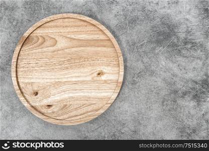 Wooden board on stone background. Kitchen table