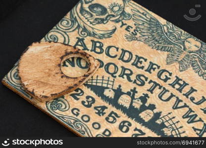 Wooden Board Ouija: Communication with Spirits, Religion Theme. Wooden Board Ouija: Communication with Spirits, Religion Theme.