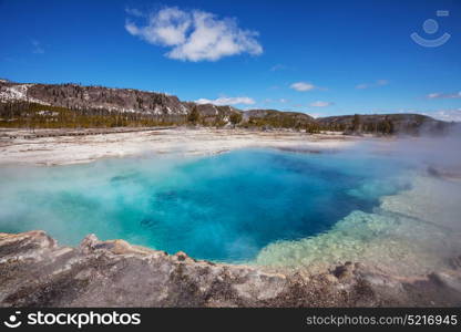 Wooden boardwalk along geyser fields in Yellowstone National Park, USA