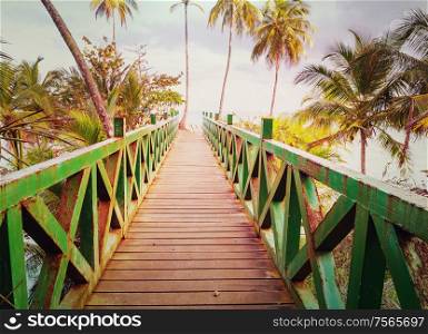 Wooden boardwalk on the tropical beach