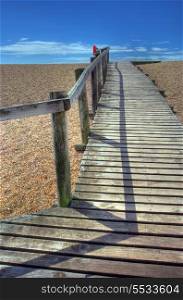 Wooden boardwalk over Chesil Beach, Dorset, England.