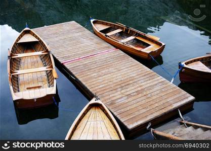 Wooden boats at the Alpine mountain lake