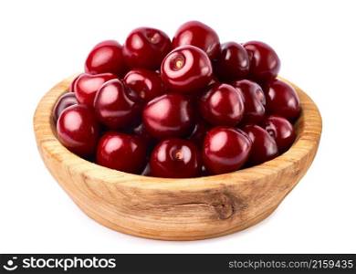 wooden bowl of sweet cherry fruits isolated on white background.. wooden bowl of sweet cherry fruits isolated on white background