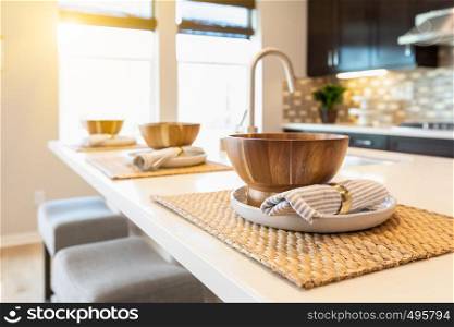 Wooden Bowl Place Settings on Kitchen Island Abstract.