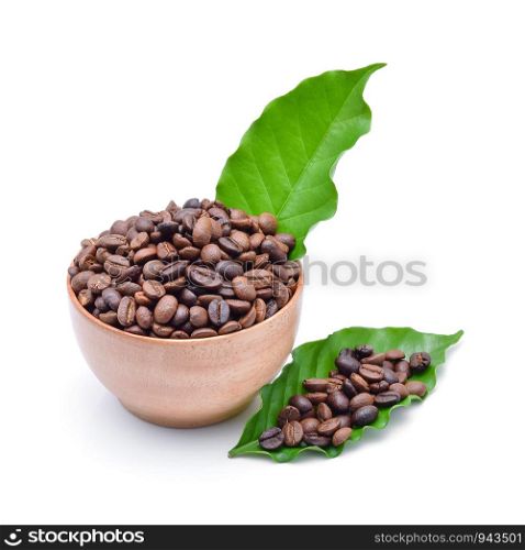 Wooden Bowl with coffee beans and coffee leaf on white background.