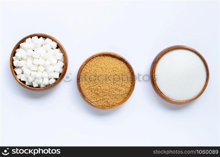 Wooden bowl with sugar on white background. Copy space