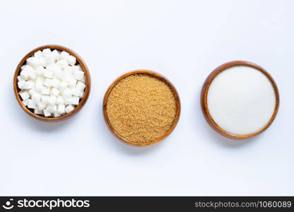 Wooden bowl with sugar on white background. Copy space