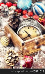 Wooden box with alarm clock,Christmas decorations,pinecone.The image is tinted.