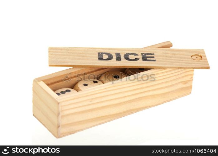 Wooden box with dices isolated over white background