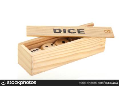 Wooden box with dices isolated over white background