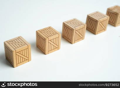 Wooden boxes standing in a row. Production and freight of goods. Neatly arranged boxes symbolize an organized and efficient process of preparing orders for shipment. Importance of proper packaging