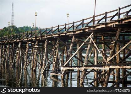 Wooden bridge across the river. Wooden bridge that spans the length of the second, Sangklaburi Kanchanaburi.