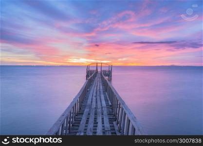 Wooden bridge along sunset sky at beautiful