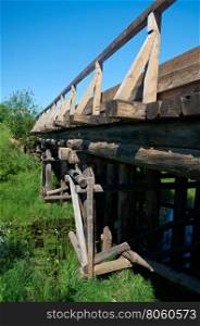 Wooden bridge.. Arkhangelsk region.